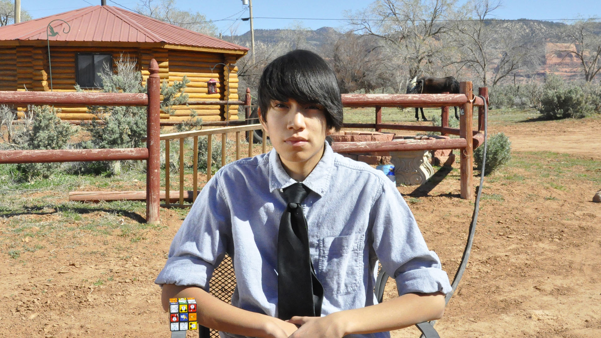 Albert Haskie and his Rubik’s cube at home in Lukachukai. Albert Haskie-3 copy.jpg