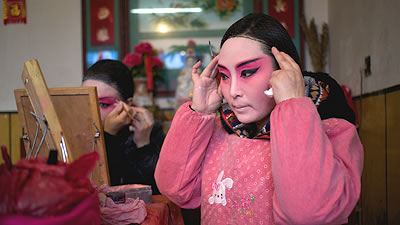 Chinese actors putting on make-up