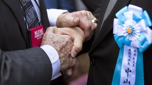 A powerful handshake of friendship on the island of Iwo Jima on March 21, 2015.
