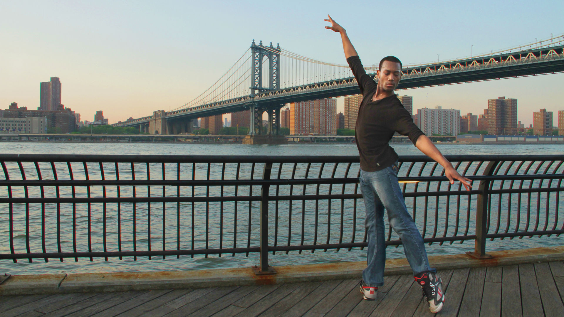 Fredrick Davis performs original choreography in front of the Brooklyn Bridge in New York. STREETS TO STAGE SIGNATURE IMAGE.jpg