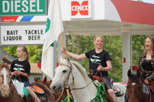 Jordan Stoltz carries the 4-H flag in a Valier, MT Parade Jordan Stoltz carries the 4-H flag in a Valier, MT Parade