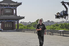 Crew member in front of camera on a crane