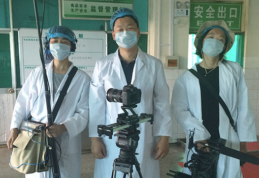 3 crew members wearing surgical masks