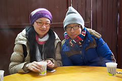 2 crew members seated at a table