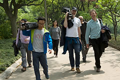 Crew members walking down a path