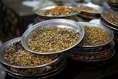 dried herbs on metal platters