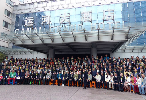 large group of people in rows posing for a group photograph