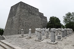 rows of statues of people without heads