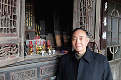 man standing in front of wooden alter