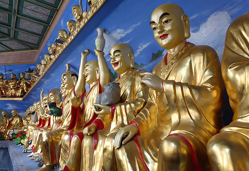 colorful Buddhist statues in various poses