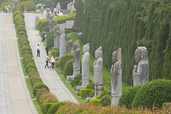 stone statues along a road