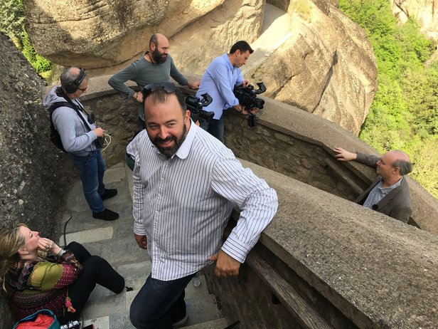 ODYSSEY crew members prepare to film Paul Neubauer at Meteora. The ERT documentary unit.